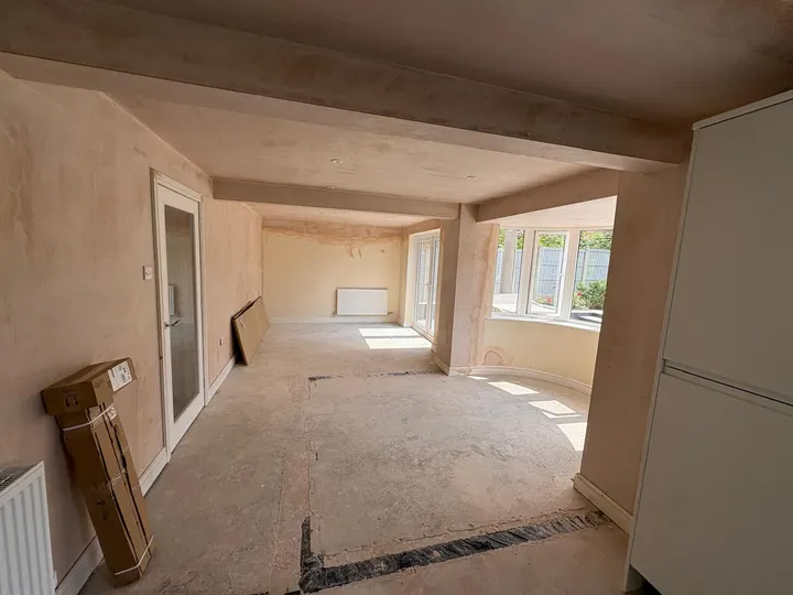 Connecting living spaces with fresh plaster during a property renovation in Grantham