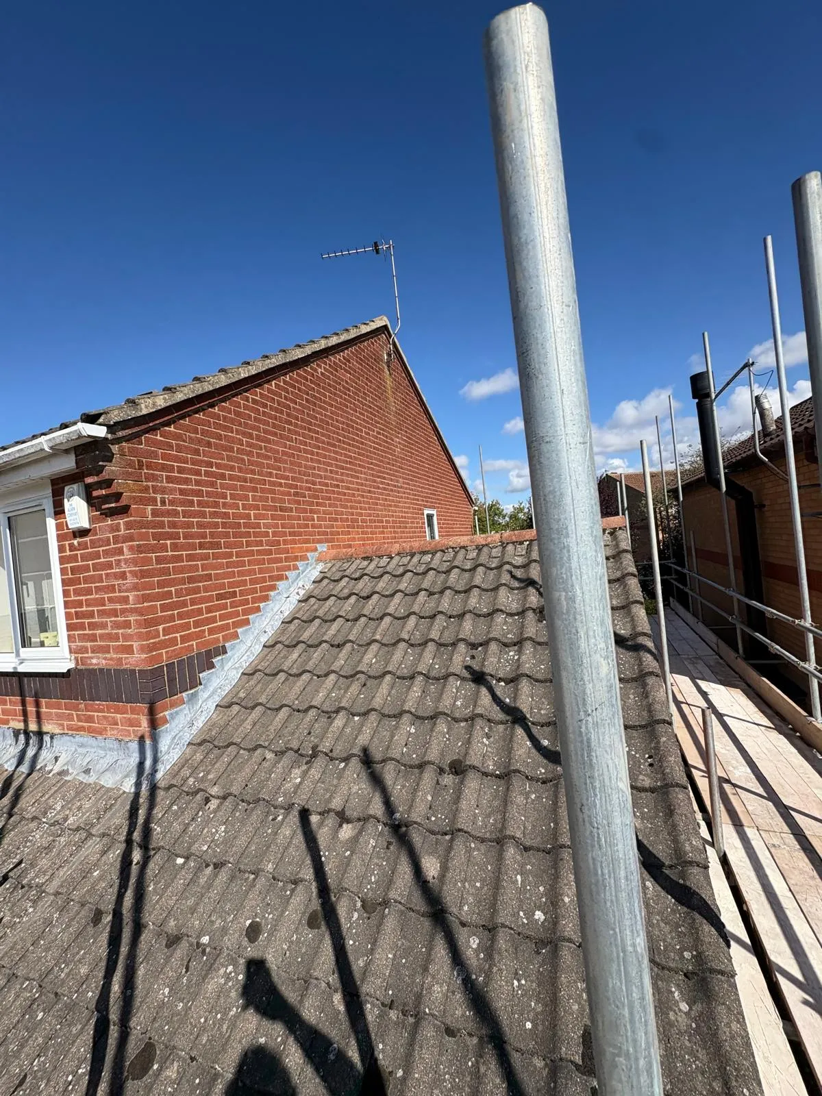 Tiled roof beside scaffolding at the Heckington extension